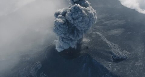 Drone captures incredible footage of man running towards erupting volcano (rumble)