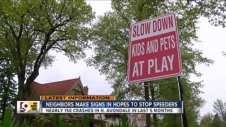 Neighbors make signs to slow speeders