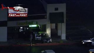 Truck backs into building near US-95, Decatur