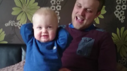 Baby Has Priceless Reaction To Dad's Soccer Chant