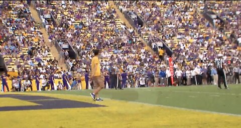 No One Notices as Man Casually Walks onto Football Field Mid Play