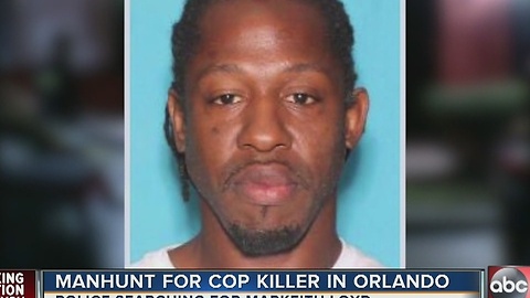 Orlando police officer shot and killed, suspect on the run