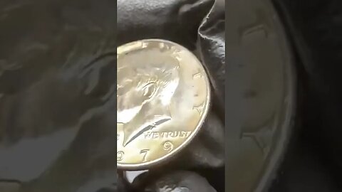 I FOUND THIS GOLD TONED HALF DOLLAR COIN ROLL HUNTING