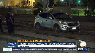 Car drives onto trolley tracks in downtown San Diego