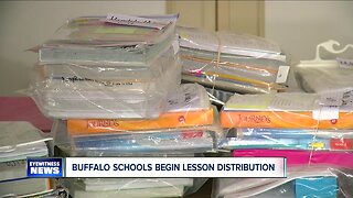 Buffalo school families picking up student lesson plans & meals