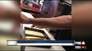 Worker caught on camera spitting on pizza