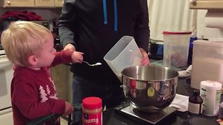 "Little Boy Makes Cake With His Dad"