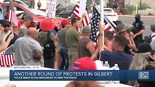 Protesters gather on Gilbert intersection