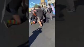 Fight breaks out between protesters and parents taking their kids to a drag show.