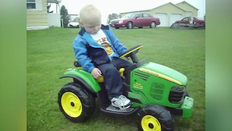 Tot Boy Sleeps While Driving His Tractor Toy