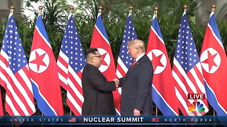 First Handshake Between a US President and NK Leader