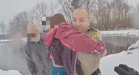 Police officer dives into freezing water to save drowning child