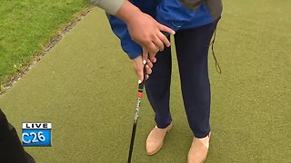 NBC26's Jennifer Nazha practices her golf swing