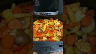 Pulling The Roasted Potatoes Out Of The Air Fryer