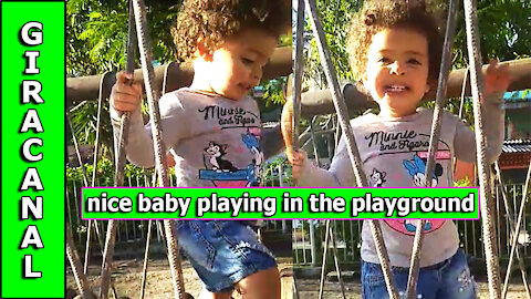 nice baby playing in the playground