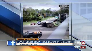 Truck overturns in intersection