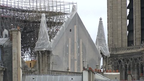 Workers install tarps to protect gutted Notre Dame from rain