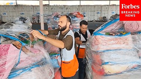 JUST IN- 34 Aid Trucks Arrive In Gaza, Workers Unload Supplies From Egypt