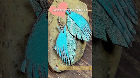 Get'n Gritty, 2 inch drop leather feather earrings