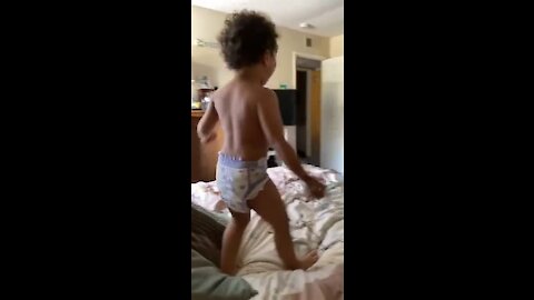 Dad and son have epic WWE wrestling match on the bed