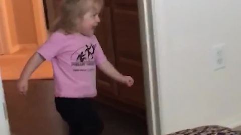 Little Girl Is Running After His Dad But Runs Into Wall