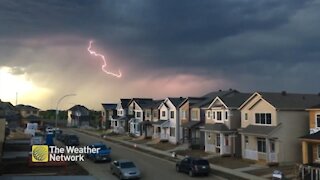 Impressive thunderstorm lights up the sky above neighbourhood