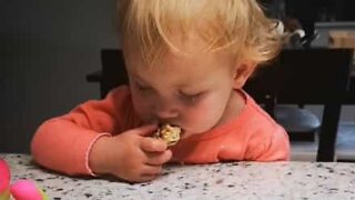 Little girl doesn't know if she wants to eat or sleep!