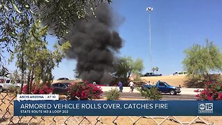 Armored vehicle rolls over, catches fire