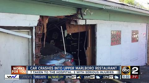 At least 7 people hurt when car drives into restaurant