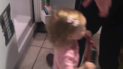 Twin toddlers help daddy unpack the groceries