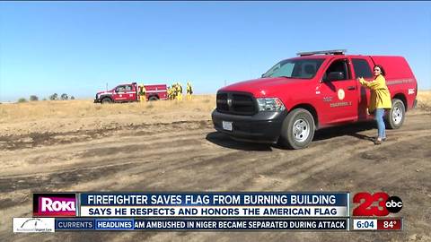 Firefighter saves flag from burning building