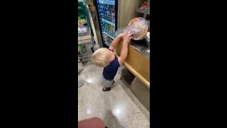 Toddler Helps Mommy With The Groceries
