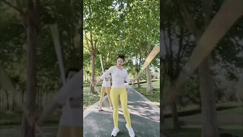 Two Chinese Girls Twirl Sticks