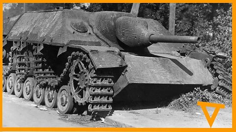 Sherman tanks driving passed a destroyed Jagdpanzer IV.