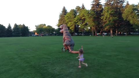 Here's a sight you don't normally see: T-Rex steals little girl's bike!