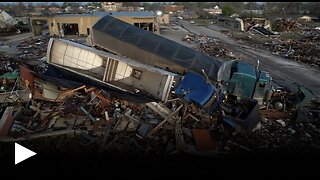 Trucks piled on buildings as tornado hits Mississippi