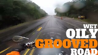 Biker on a Wet Oily Grooved Road