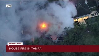 Tampa Fire Rescues battles large house structure fire