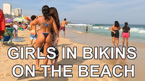 GIRLS IN BIKINS ON THE BEACH