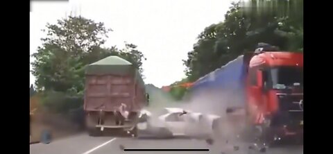 The overtaking car was sandwiched between two big trucks