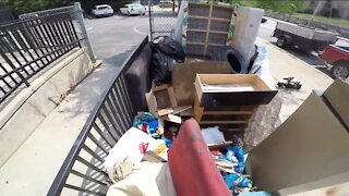 Grass clippings, food containers among trash dropped off almost daily at Milwaukee thrift store