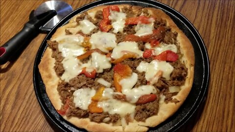 Philly cheesesteak pizza with roasted red garden peppers!