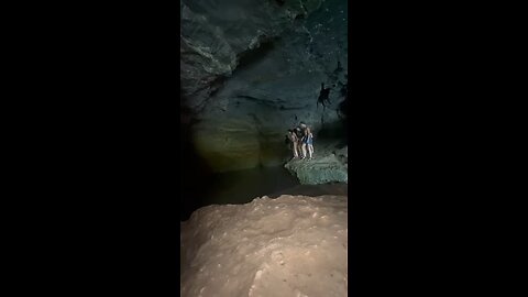 Jumping into a beautiful blue cave pool