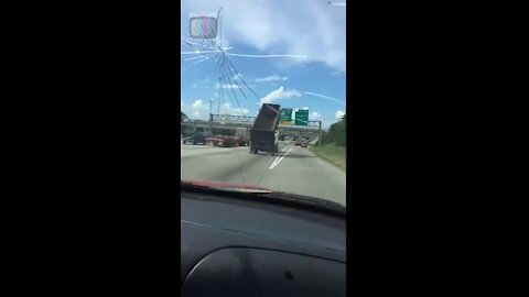 Driver Witnesses Dump Truck Crash Into Highway Sign in Jacinto City, TEXAS