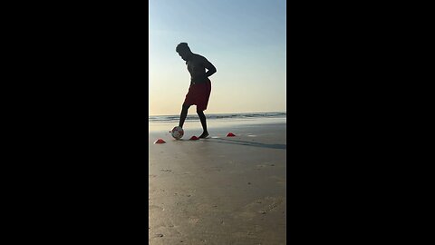 Dribbling soccer drill on the beach