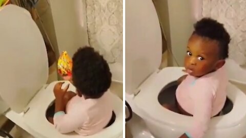 Baby Caught Eating Snacks While Sitting In The Toilet