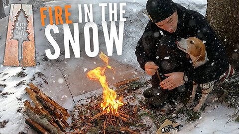 Starting a Fire on a Snowy Mountain Summit Adventure