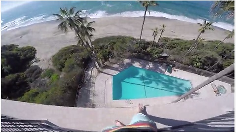 A Kid Jumps Off A Six-Storey Balcony Into A Pool