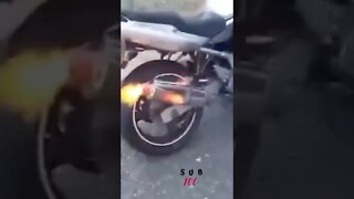 MOTORBIKE CATCHES FIRE SPITTING FLAMES