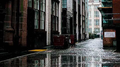 Rain over the cobblestoned back alley of Lancaster House in Manchester, England